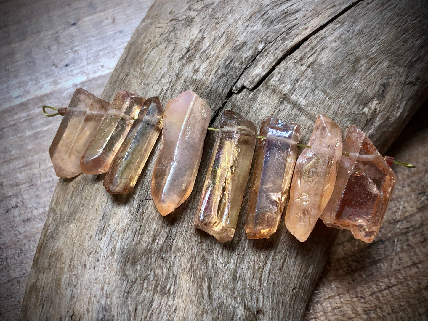 Graduated AB Bronze Coated Quartz Sticks - 27mm x 9mm to 19mm x 9mm - 2.5" Strand