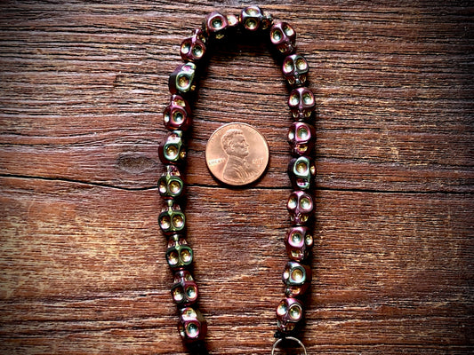 Hematite Electroplated Skulls Strand - 10mm x 8mm - 8"