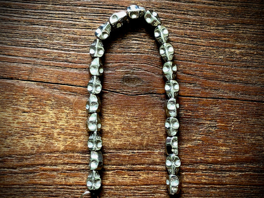 Hematite Electroplated Skulls Strand - 10mm x 8mm - 8"