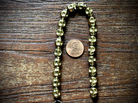 Hematite Electroplated Skulls Strand - 10mm x 8mm - 8"