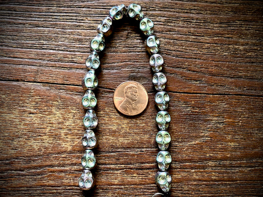 Hematite Electroplated Skulls Strand - 10mm x 8mm - 8"